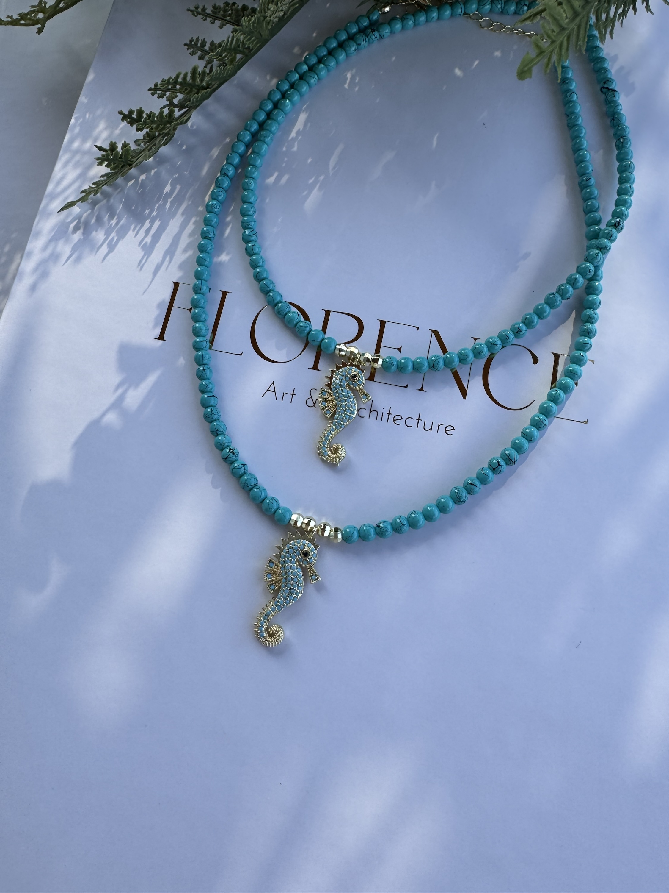 Mavi boncuklu deniz atı kolye